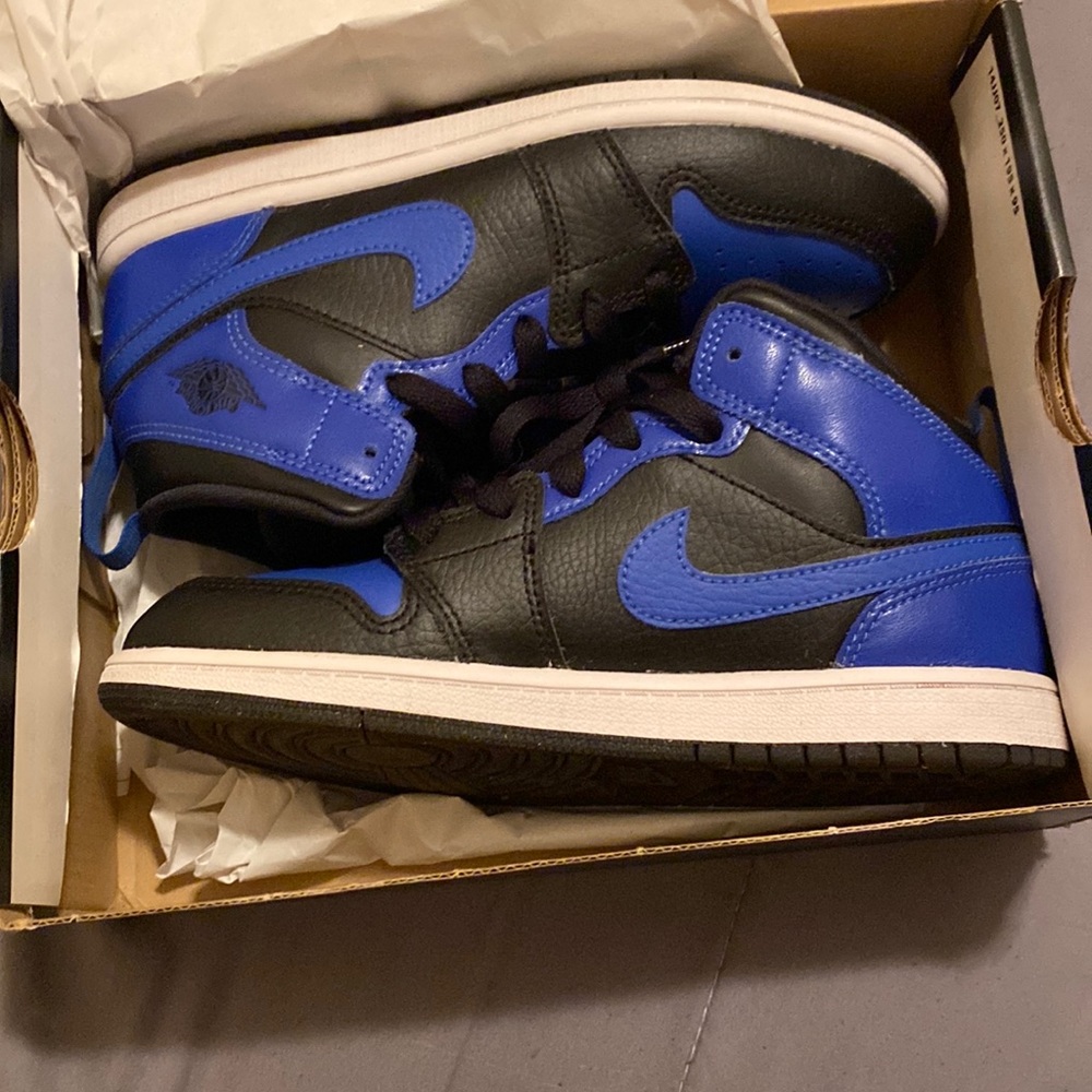 Blue and black Jordan mids